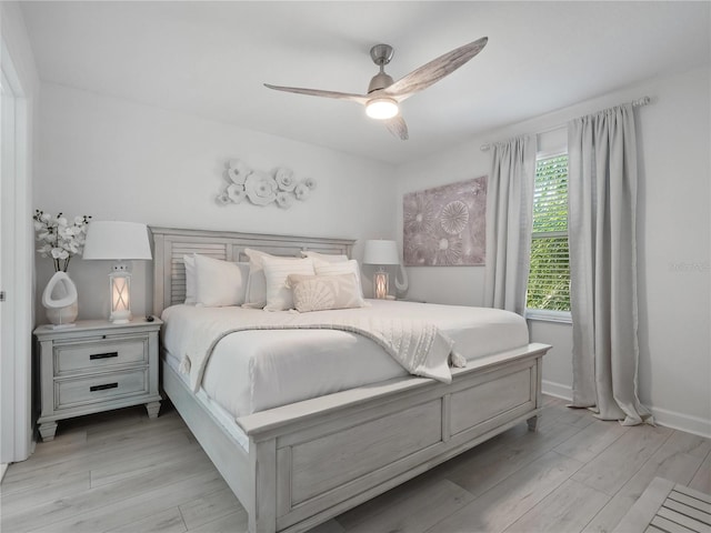 681 Pebble Beach Dr, Davenport, FL 33896 - bedroom with light wood-style floors and a ceiling fan