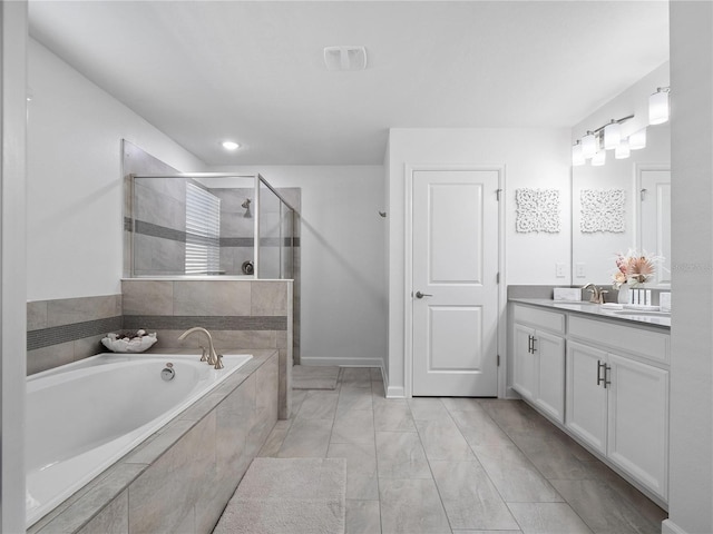 681 Pebble Beach Dr, Davenport, FL 33896 - full bath with vanity, a bath, a stall shower, recessed lighting, and marble finish floors