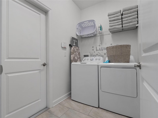 681 Pebble Beach Dr, Davenport, FL 33896 - laundry room with washer and dryer and light tile patterned floors