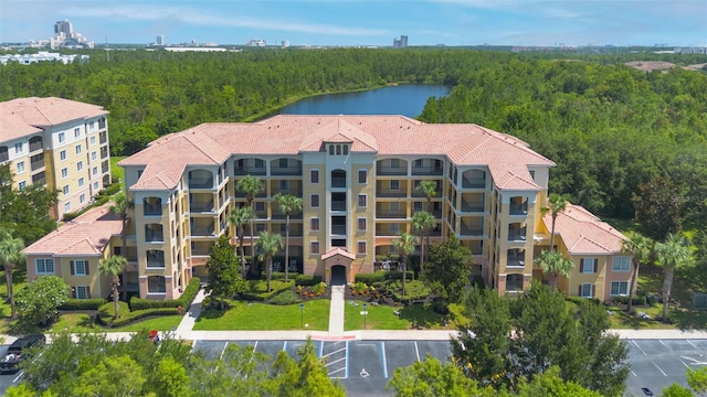 8774 Worldquest Blvd Unit 7404, Orlando, FL 32821 - drone / aerial view of a heavily wooded area and a large body of water