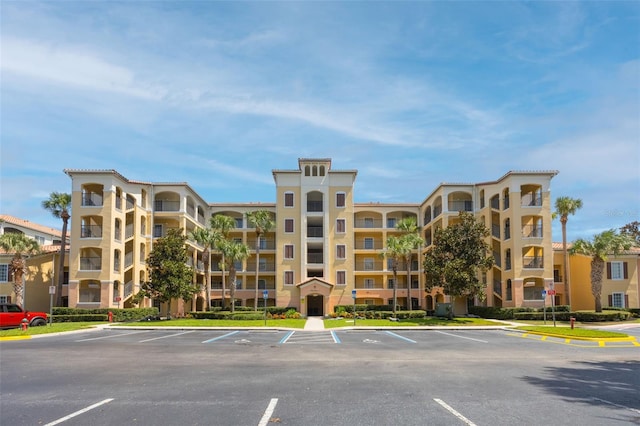 8774 Worldquest Blvd Unit 7404, Orlando, FL 32821 - view of apartment building / complex featuring uncovered parking
