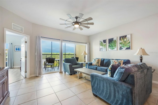 8774 Worldquest Blvd Unit 7404, Orlando, FL 32821 - living room with a ceiling fan and light tile patterned floors