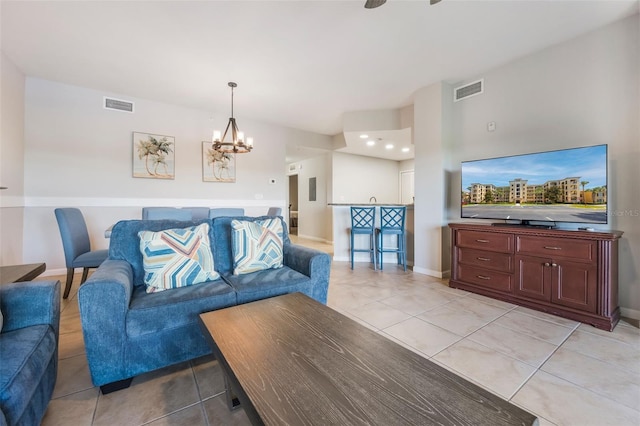 8774 Worldquest Blvd Unit 7404, Orlando, FL 32821 - living room with light tile patterned floors and a chandelier