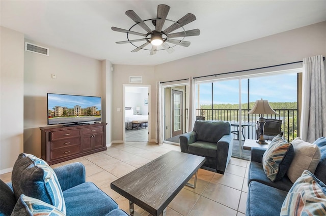 8774 Worldquest Blvd Unit 7404, Orlando, FL 32821 - living room with ceiling fan and light tile patterned floors