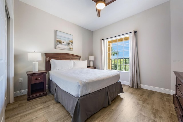 8774 Worldquest Blvd Unit 7404, Orlando, FL 32821 - bedroom with light wood-type flooring and a ceiling fan