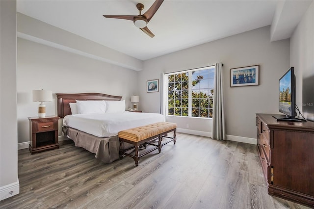 8774 Worldquest Blvd Unit 7404, Orlando, FL 32821 - bedroom featuring wood finished floors and a ceiling fan