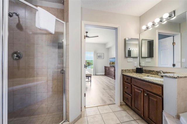 8774 Worldquest Blvd Unit 7404, Orlando, FL 32821 - full bath with vanity, a stall shower, a ceiling fan, and tile patterned flooring