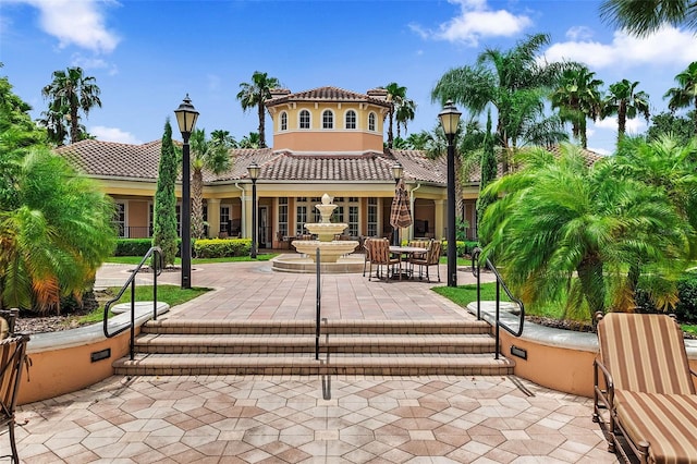 8774 Worldquest Blvd Unit 7404, Orlando, FL 32821 - back of house with a tiled roof, a patio area, and stucco siding