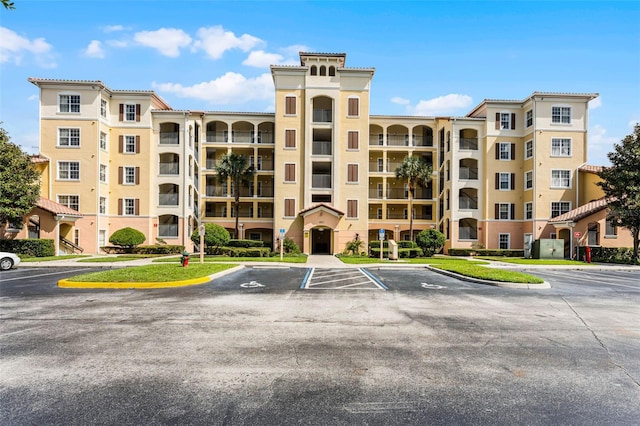 8774 Worldquest Blvd Unit 7404, Orlando, FL 32821 - view of apartment building / complex featuring uncovered parking