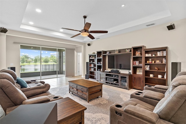 1817 Westerham Ave, Saint Cloud, FL 34771 - living room featuring a raised ceiling, a ceiling fan, and recessed lighting