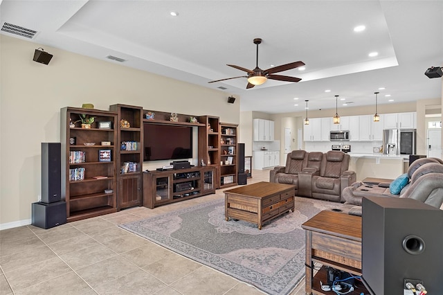1817 Westerham Ave, Saint Cloud, FL 34771 - living room featuring a tray ceiling, a ceiling fan, recessed lighting, and light tile patterned floors
