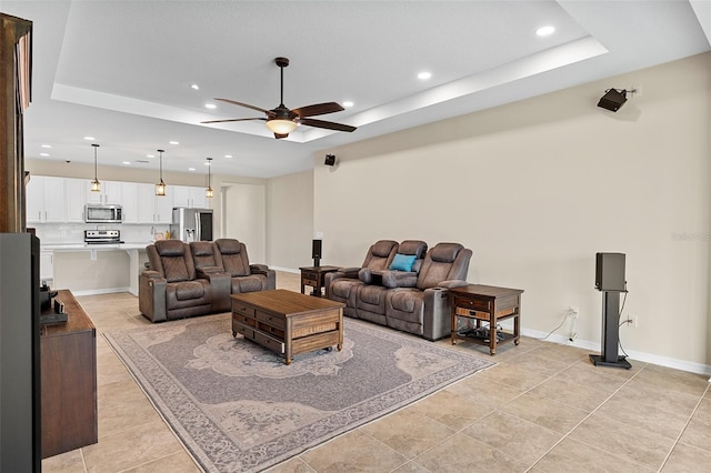 1817 Westerham Ave, Saint Cloud, FL 34771 - living area with a raised ceiling, ceiling fan, recessed lighting, and light tile patterned floors