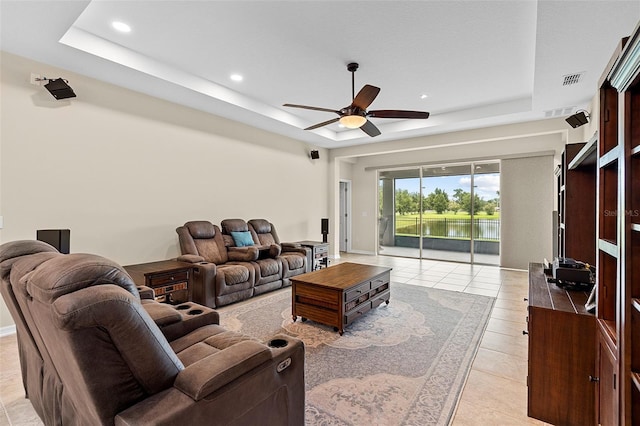 1817 Westerham Ave, Saint Cloud, FL 34771 - living room with a tray ceiling, ceiling fan, light tile patterned floors, and recessed lighting