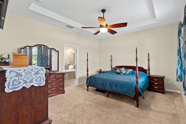 1817 Westerham Ave, Saint Cloud, FL 34771 - bedroom featuring a raised ceiling, carpet flooring, and connected bathroom