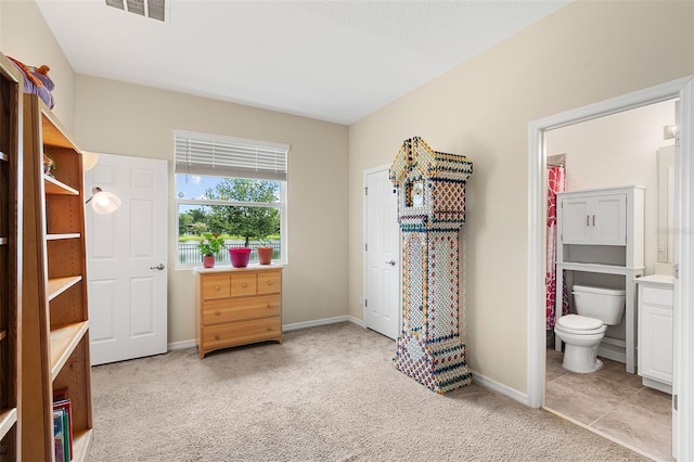 1817 Westerham Ave, Saint Cloud, FL 34771 - bedroom with light colored carpet and connected bathroom