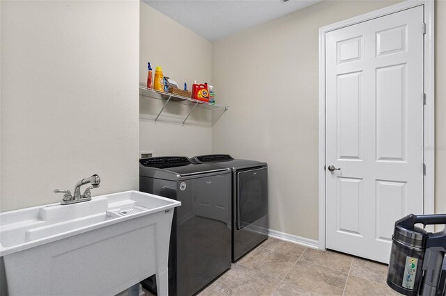 1817 Westerham Ave, Saint Cloud, FL 34771 - laundry room featuring separate washer and dryer and baseboards