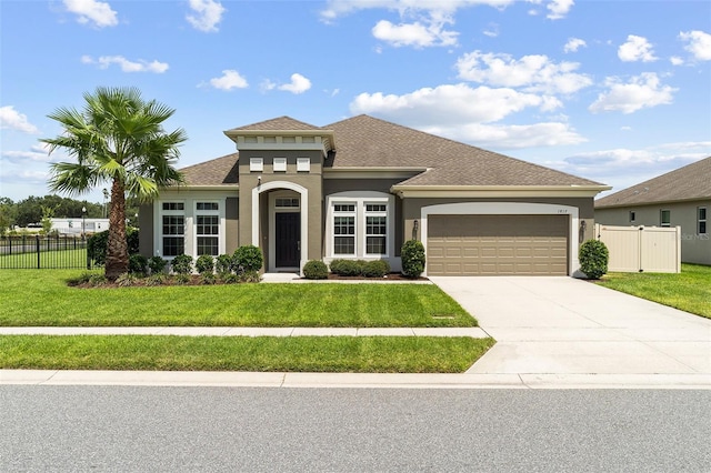 1817 Westerham Ave, Saint Cloud, FL 34771 - mediterranean / spanish-style house with a garage, stucco siding, driveway, and roof with shingles