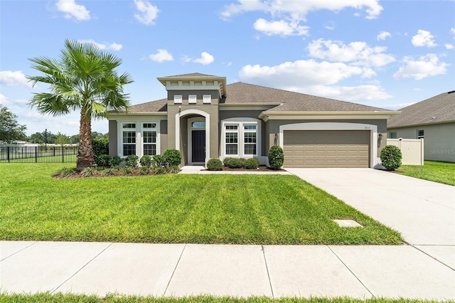 1817 Westerham Ave, Saint Cloud, FL 34771 - mediterranean / spanish home with an attached garage, stucco siding, concrete driveway, and roof with shingles