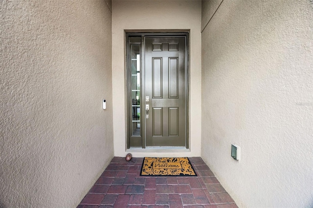 2000 Goblet Cove St, Kissimmee, FL 34746 - doorway to property with stucco siding
