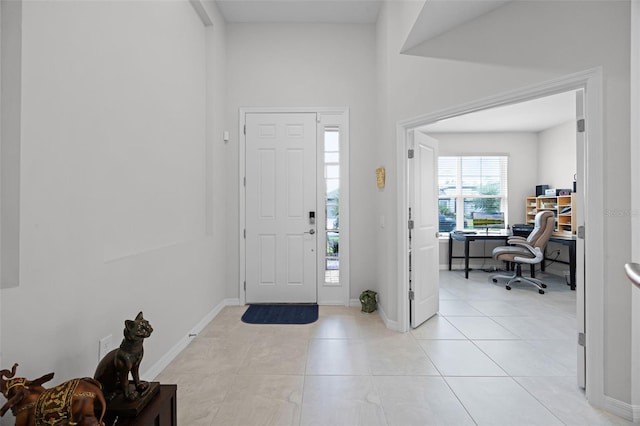 2000 Goblet Cove St, Kissimmee, FL 34746 - foyer featuring light tile patterned floors and baseboards