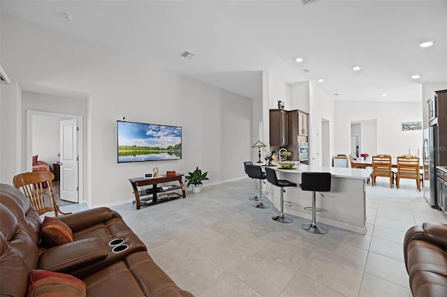 2000 Goblet Cove St, Kissimmee, FL 34746 - living area featuring light tile patterned floors and recessed lighting