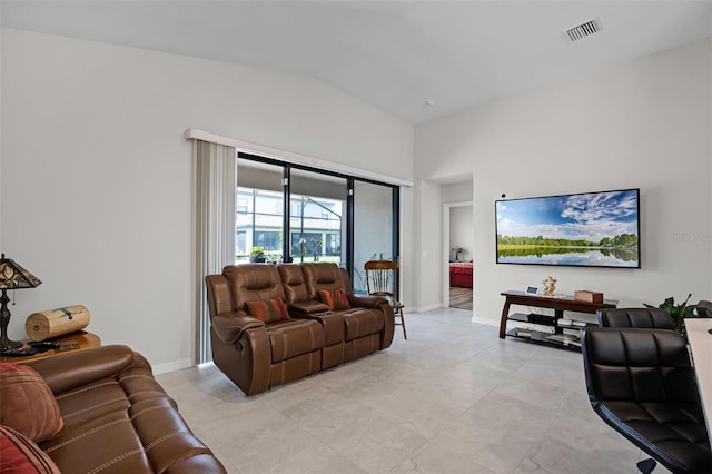 2000 Goblet Cove St, Kissimmee, FL 34746 - living room featuring baseboards and high vaulted ceiling