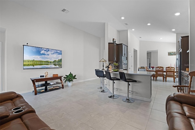 2000 Goblet Cove St, Kissimmee, FL 34746 - living area featuring recessed lighting, light tile patterned floors, and high vaulted ceiling