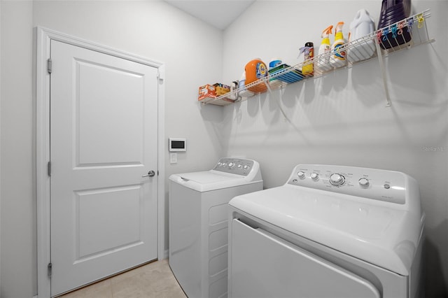 2000 Goblet Cove St, Kissimmee, FL 34746 - laundry area with separate washer and dryer and light tile patterned floors