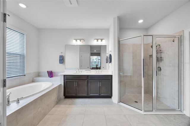 2000 Goblet Cove St, Kissimmee, FL 34746 - full bath featuring a bath, double vanity, a shower stall, healthy amount of natural light, and recessed lighting