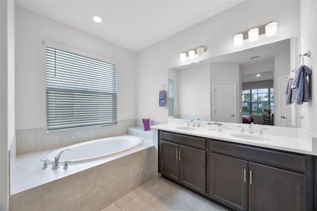 2000 Goblet Cove St, Kissimmee, FL 34746 - ensuite bathroom with double vanity, a garden tub, and tile patterned flooring