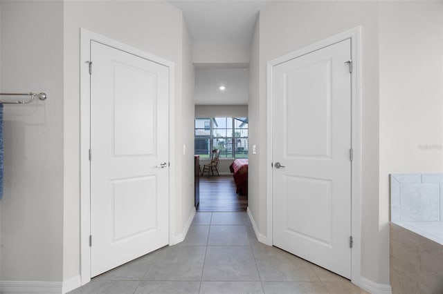 2000 Goblet Cove St, Kissimmee, FL 34746 - hallway featuring light tile patterned flooring and baseboards