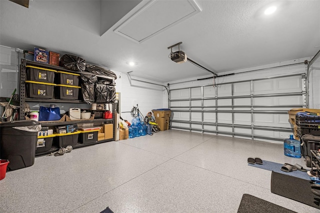 2000 Goblet Cove St, Kissimmee, FL 34746 - garage with concrete block wall, a garage door opener, and recessed lighting