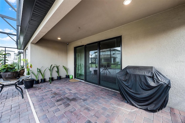 2000 Goblet Cove St, Kissimmee, FL 34746 - view of patio featuring area for grilling and glass enclosure