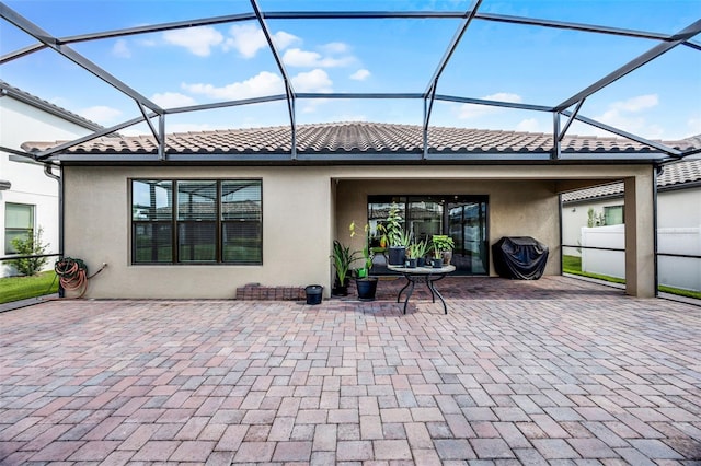 2000 Goblet Cove St, Kissimmee, FL 34746 - view of patio / terrace with glass enclosure and area for grilling