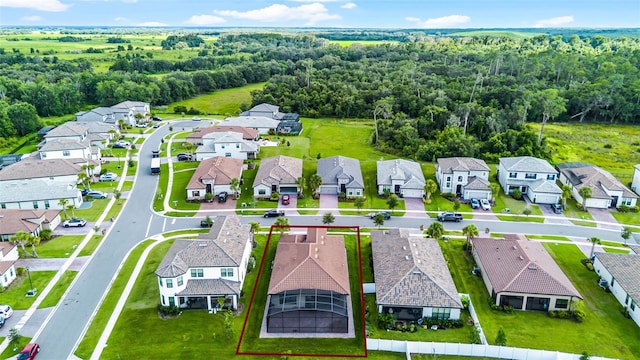 2000 Goblet Cove St, Kissimmee, FL 34746 - aerial perspective of suburban area with property parcel outlined and a forest