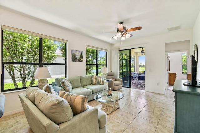 3390 Fallbrook Dr, Kissimmee, FL 34759 - living area featuring a ceiling fan and light tile patterned floors