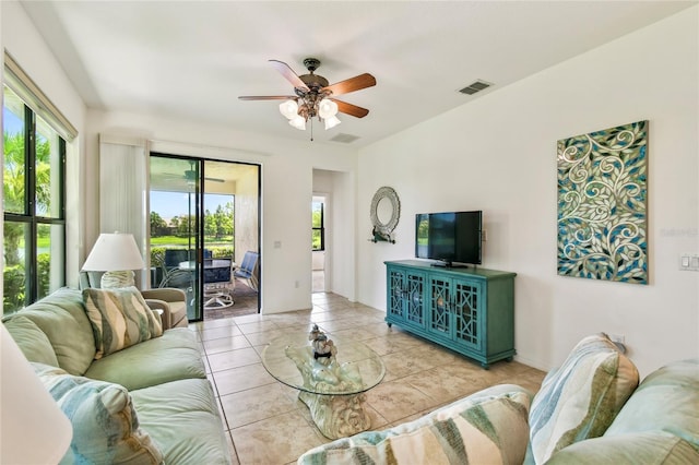 3390 Fallbrook Dr, Kissimmee, FL 34759 - living area with ceiling fan and tile patterned flooring