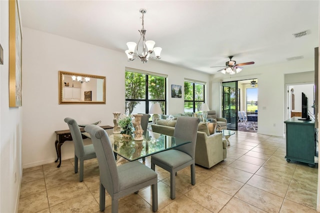 3390 Fallbrook Dr, Kissimmee, FL 34759 - dining space with a chandelier, a ceiling fan, and light tile patterned flooring
