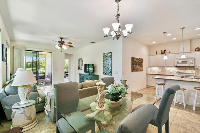 3390 Fallbrook Dr, Kissimmee, FL 34759 - dining room featuring a ceiling fan, recessed lighting, a chandelier, and light tile patterned floors