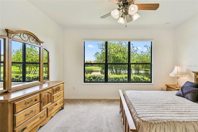 3390 Fallbrook Dr, Kissimmee, FL 34759 - bedroom featuring light carpet and ceiling fan