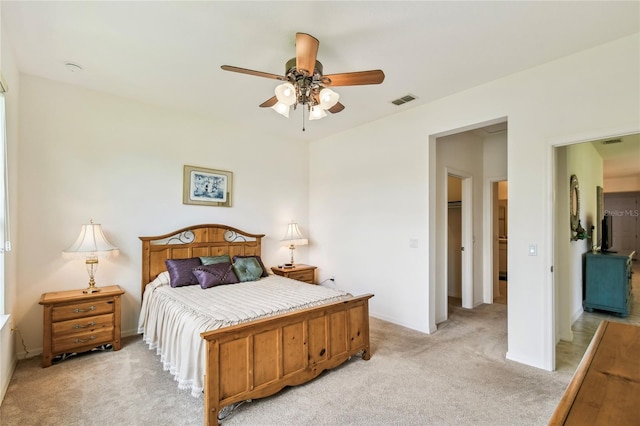 3390 Fallbrook Dr, Kissimmee, FL 34759 - bedroom with light carpet and a ceiling fan