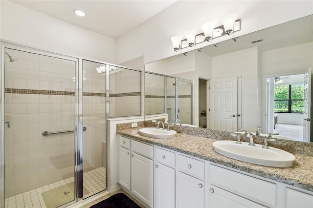 3390 Fallbrook Dr, Kissimmee, FL 34759 - bathroom with double vanity, a stall shower, and recessed lighting