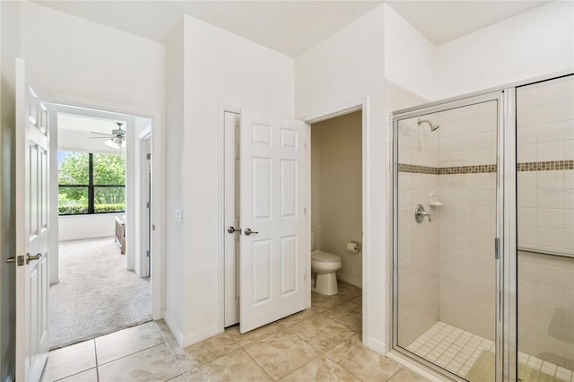 3390 Fallbrook Dr, Kissimmee, FL 34759 - bathroom with a stall shower, a ceiling fan, and tile patterned floors