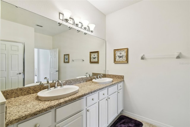 3390 Fallbrook Dr, Kissimmee, FL 34759 - full bathroom featuring double vanity and tile patterned floors