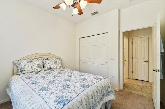 3390 Fallbrook Dr, Kissimmee, FL 34759 - bedroom featuring carpet, a closet, a ceiling fan, and tile patterned floors