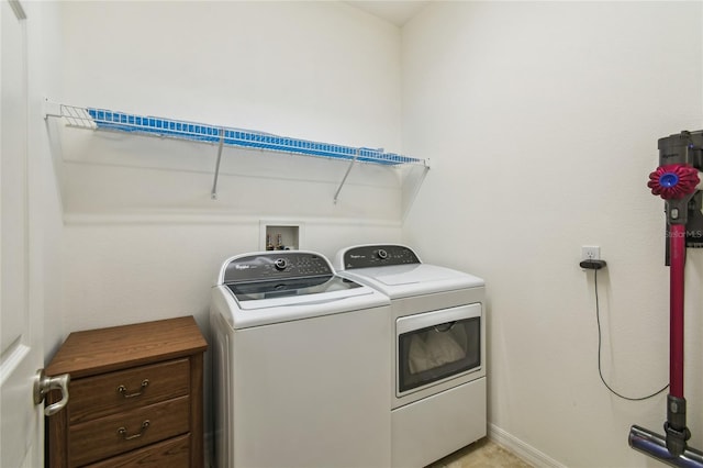 3390 Fallbrook Dr, Kissimmee, FL 34759 - washroom featuring washing machine and clothes dryer and baseboards