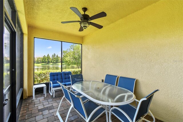 3390 Fallbrook Dr, Kissimmee, FL 34759 - sunroom featuring a ceiling fan, a water view, and plenty of natural light