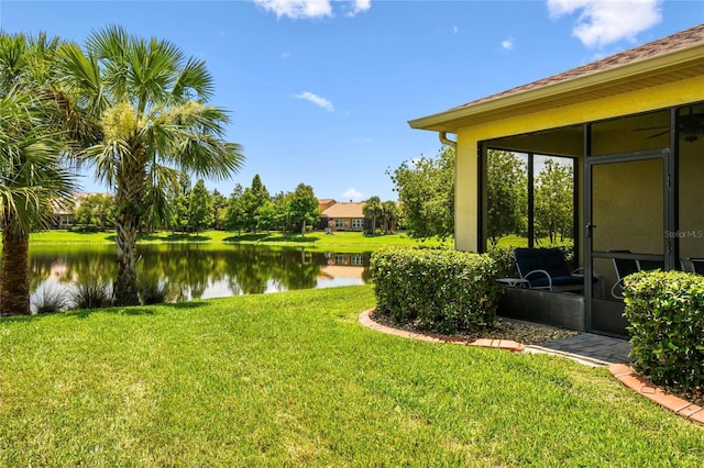 3390 Fallbrook Dr, Kissimmee, FL 34759 - view of grassy yard featuring a water view and a sunroom