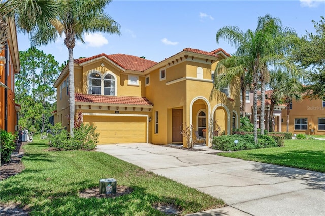 143 Tiger Lily Ct, Davenport, FL 33837 - mediterranean / spanish home with a tile roof, stucco siding, concrete driveway, an attached garage, and a front yard