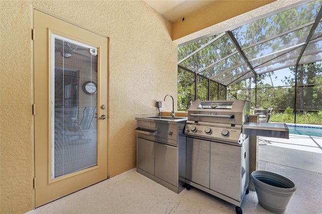 143 Tiger Lily Ct, Davenport, FL 33837 - view of patio / terrace with exterior kitchen, an outdoor pool, and glass enclosure